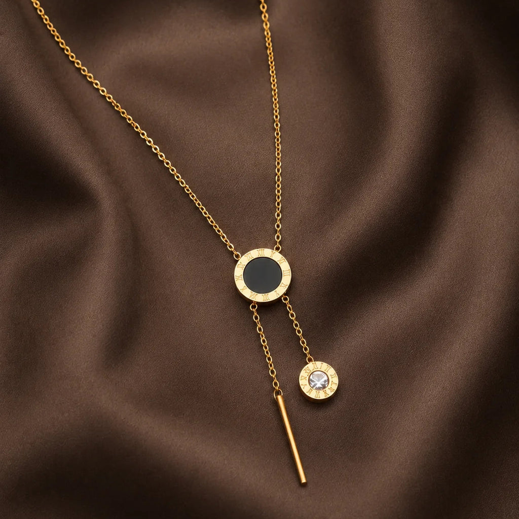 Danylor Éclipse gold-tone necklace with circular pendant and crystal drop