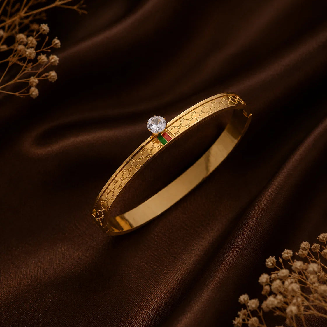 Danylor Royale gold-tone bangle with engraved details and crystal